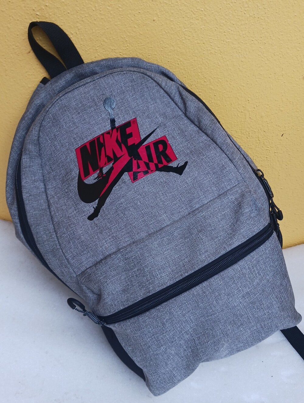 Nike Grey Backpack with Red and Black Nike Air Logo
